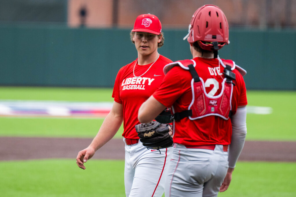 Dye congratulates Hertzler after striking out the side.