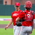 Dye congratulates Hertzler after striking out the side.